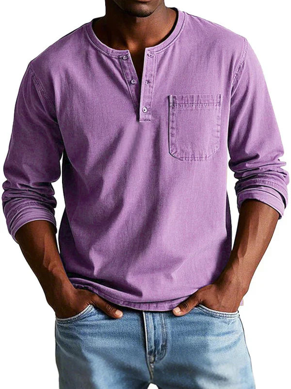 Textured fabric detail of a men's casual long sleeve button neck shirt, indicating quality and comfort.