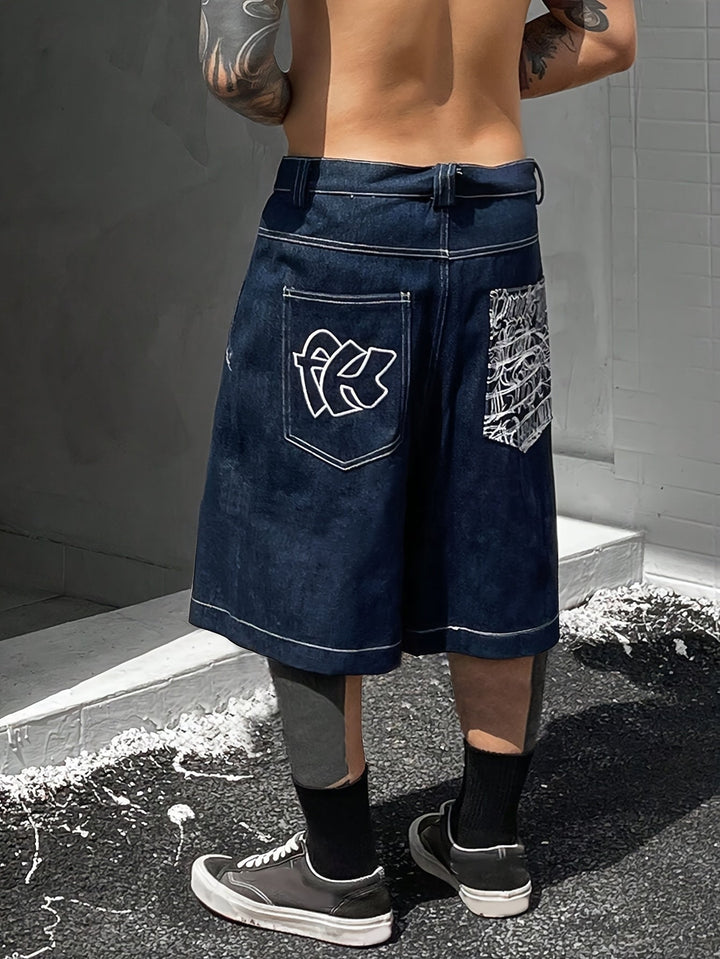 Knee-length men's denim Bermuda shorts, loose fit with intricate floral embroidery for a trendy look.