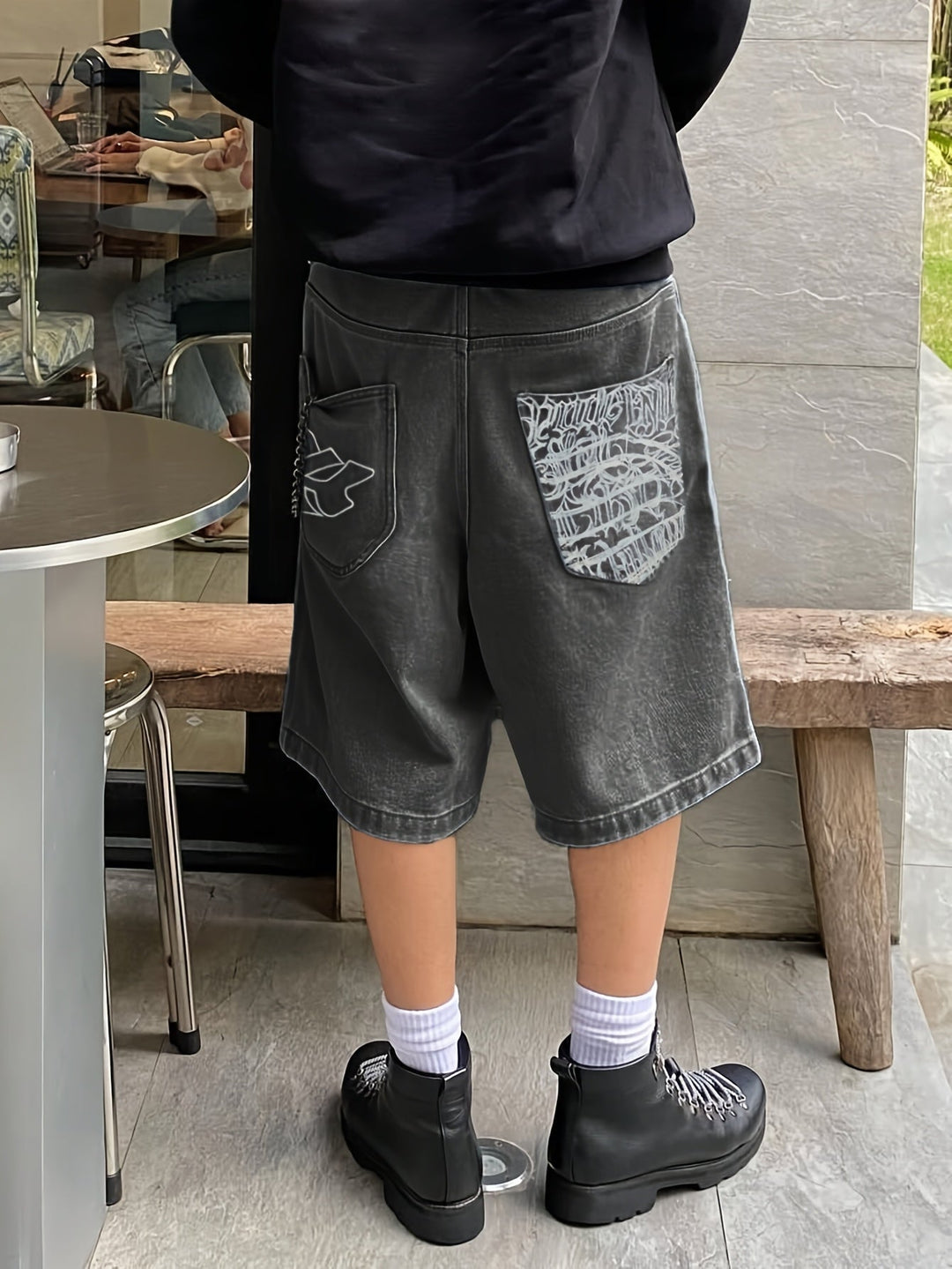 Casual men's summer Bermuda shorts, loose fit denim, decorated with stylish floral embroidery.