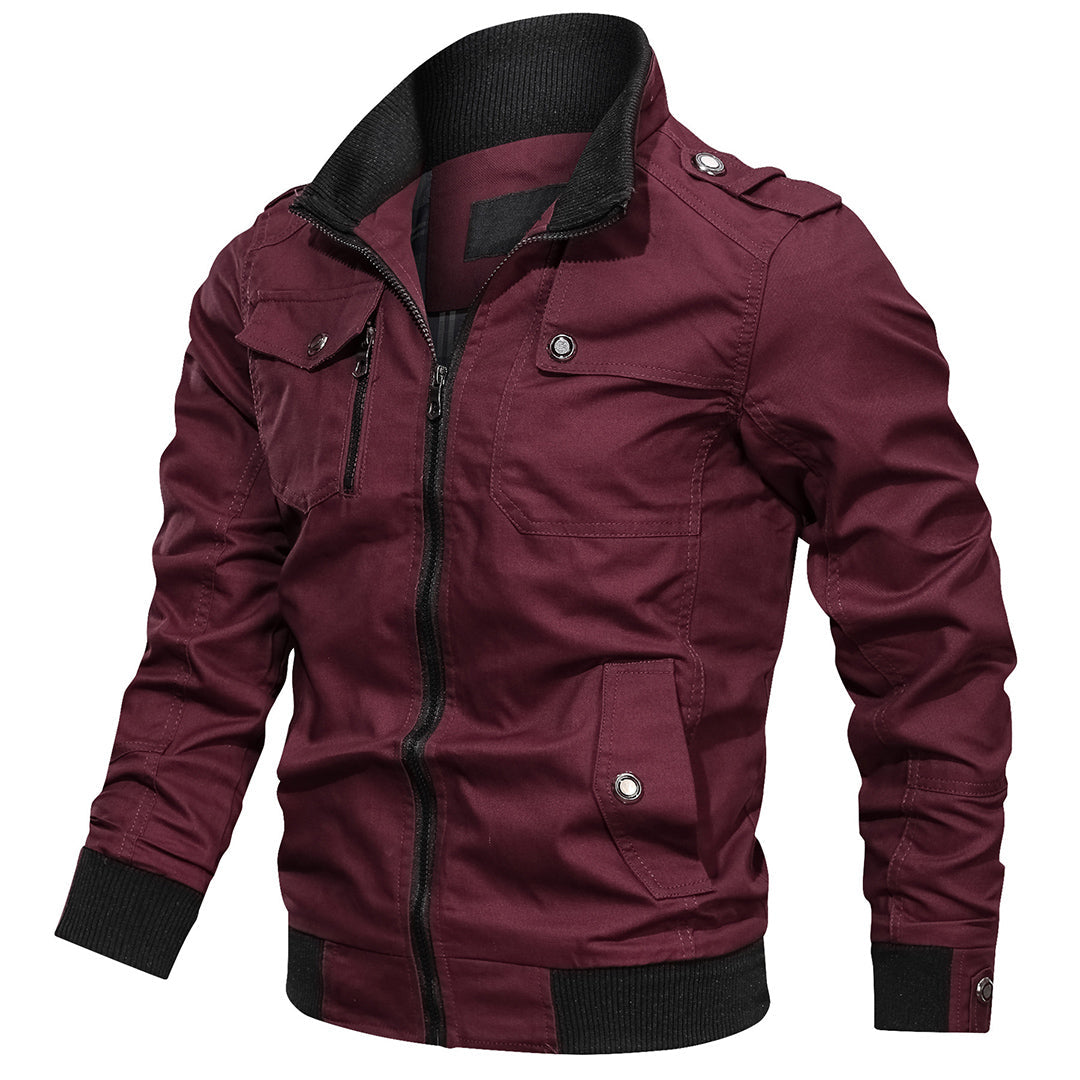 Lightweight men's outdoor jacket, zip-up with ribbed cuffs, styled for comfortable casual wear.