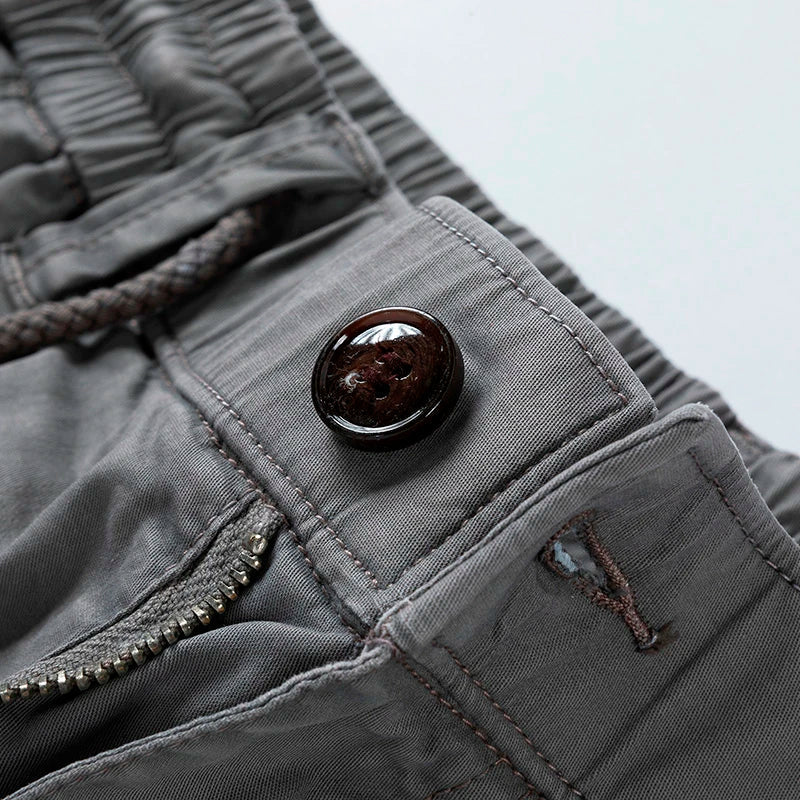 Black relaxed fit men's utility cargo shorts with drawstring waist for practical summer wear.