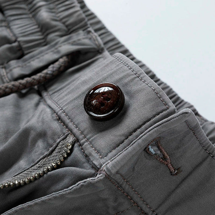 Black relaxed fit men's utility cargo shorts with drawstring waist for practical summer wear.