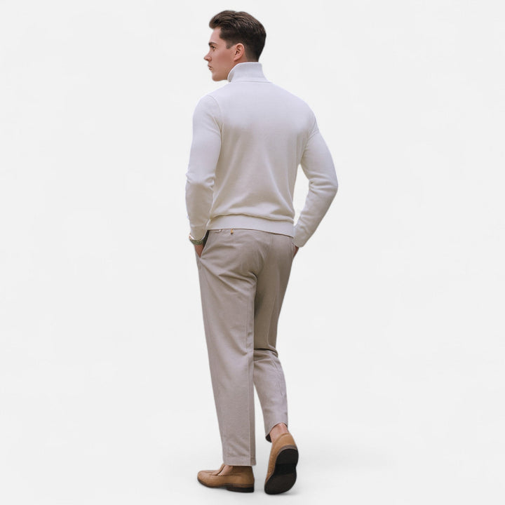 Men's apparel: long sleeve half-zip knit sweater with a modern, comfortable fit.