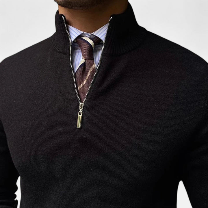Detail of the half-zip closure on a men's knit sweater, combining style and comfort.
