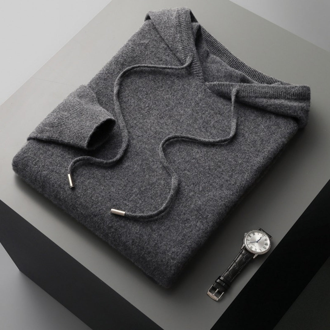 Close-up of a men's hooded sweater, showcasing the soft knit texture and ribbed cuffs for spring comfort.