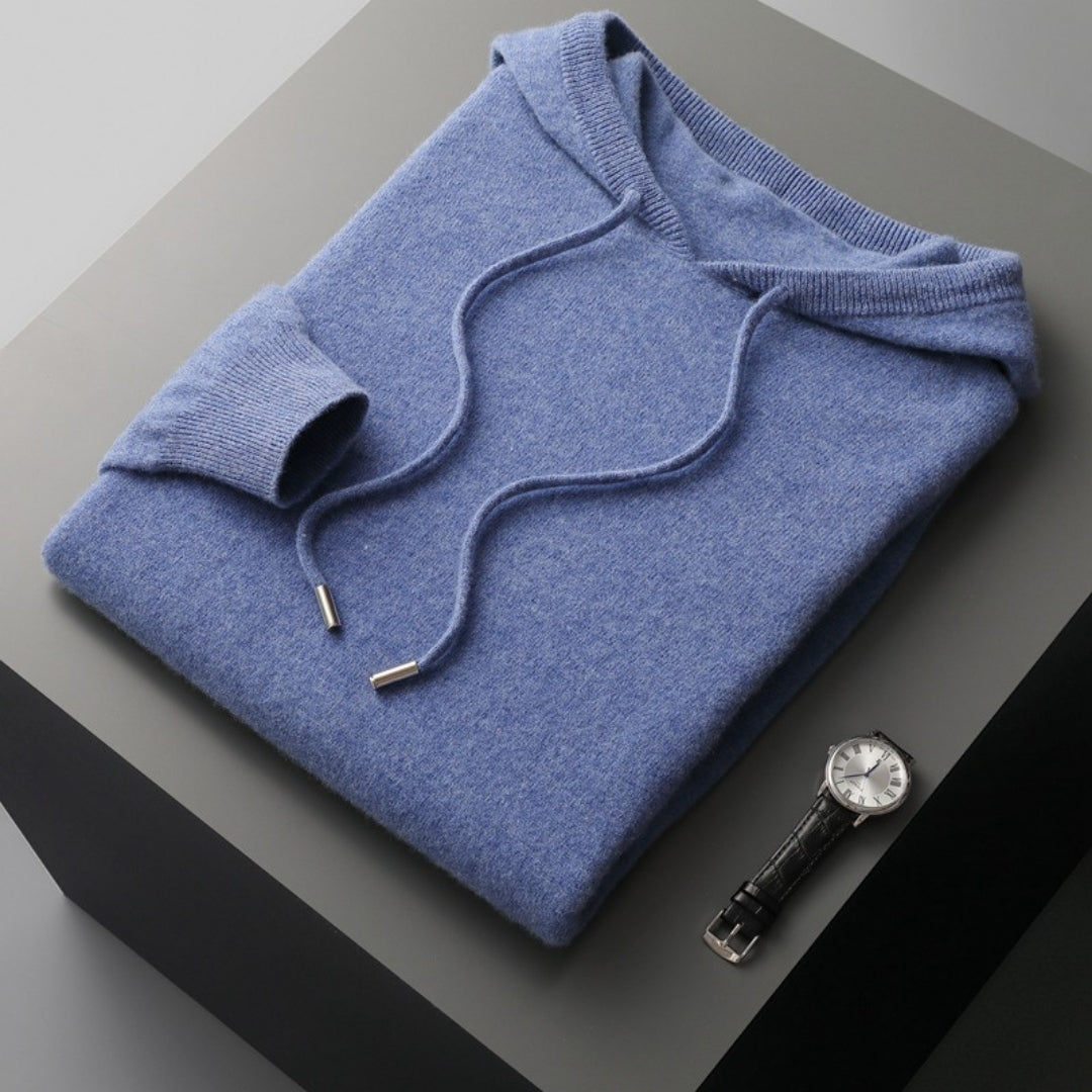 Layered look: Men's casual knit pullover hoodie in evergreen, styled over a t-shirt for spring.