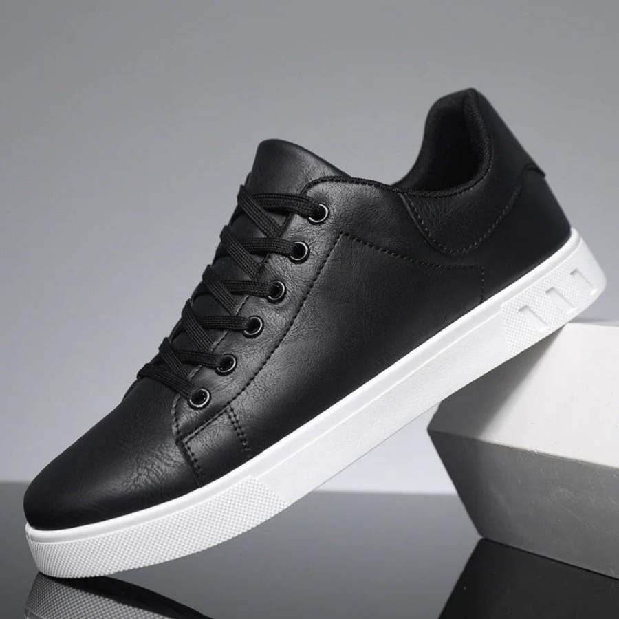 Close-up of men's fashion sneakers, highlighting the lace-up detail and textured street-style design.
