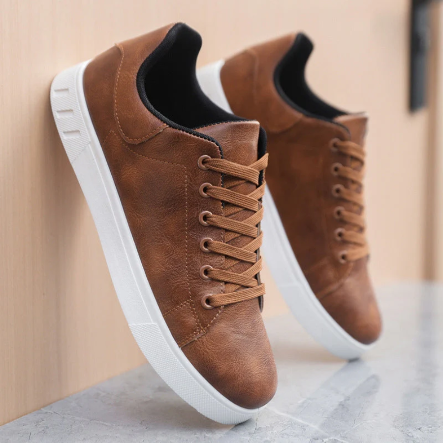 Detail shot of the sole of men's fashion sneakers, featuring grip and durability for everyday street wear.