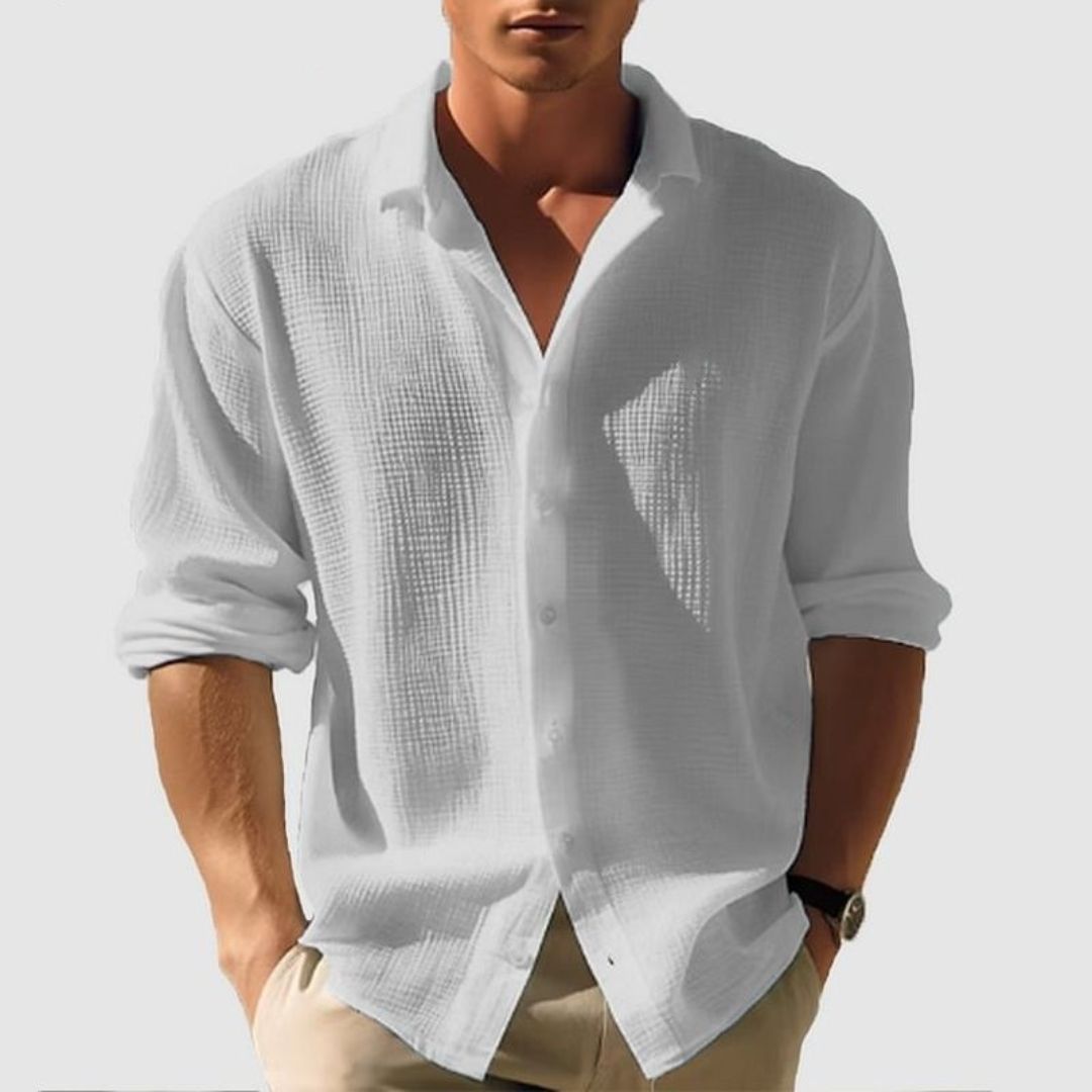 Stylish man in a casual long sleeve button-up waffle shirt. Comfortable and versatile for everyday wear.