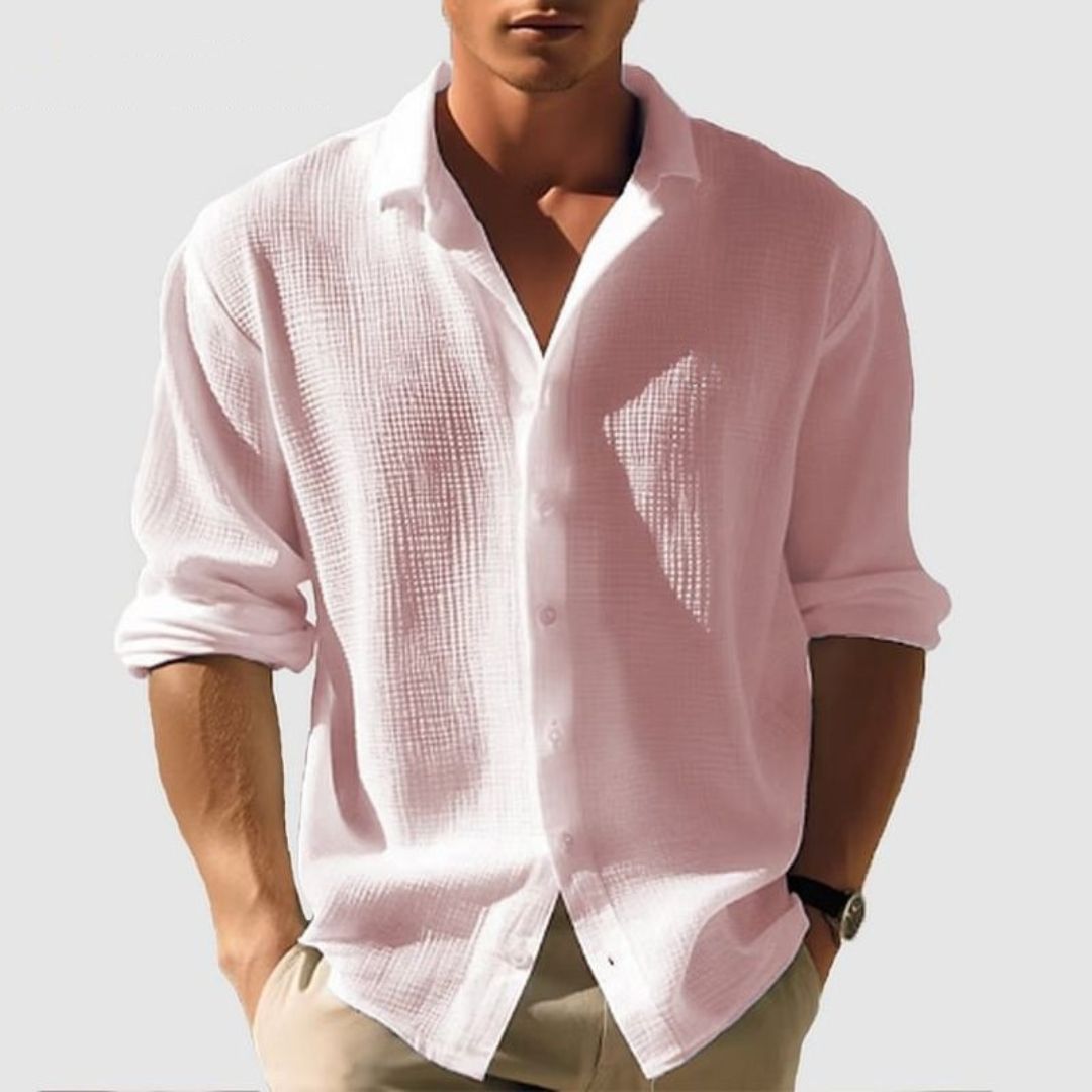 Detail of the textured waffle fabric on a men's long sleeve button-up shirt, highlighting casual style & comfort.