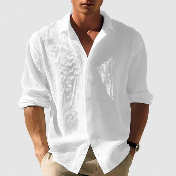 Folded men's casual long sleeve waffle shirt, a comfortable and stylish textured button-up for effortless everyday looks.