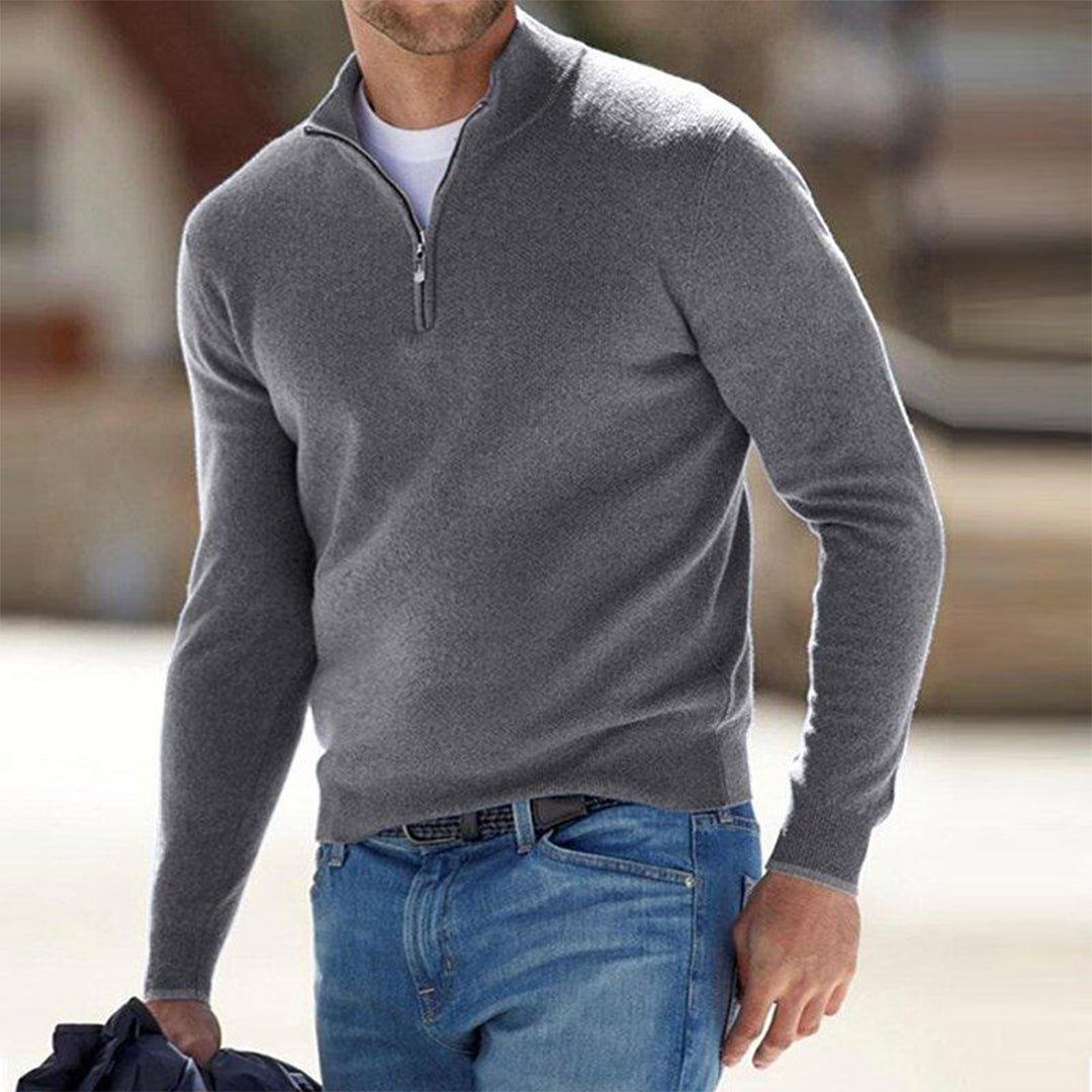 Stylish man wearing a comfortable grey zip neck sweater, ideal for casual fashion