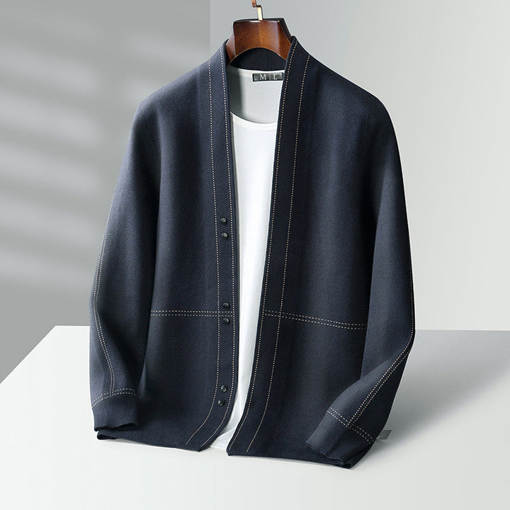 Men's smart casual plaid cardigan layered over a shirt, creating a stylish fall fashion look.