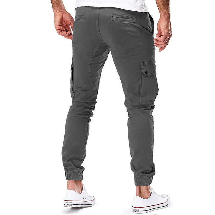 Stylish men's cargo pants, relaxed fit, black, showing side pockets and drawstring waist