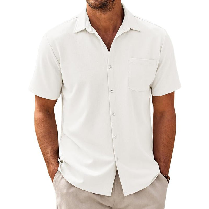 Solid color men's button-up shirt, short sleeve, featuring a chest pocket; versatile for casual fashion.