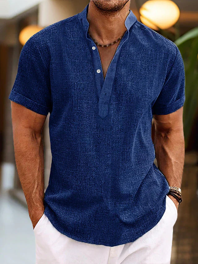 Model wearing a comfortable black short sleeve henley shirt, showcasing relaxed summer fashion