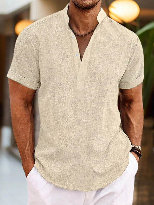 Folded green men's casual short sleeve henley, emphasizing its versatility and easy-care apparel