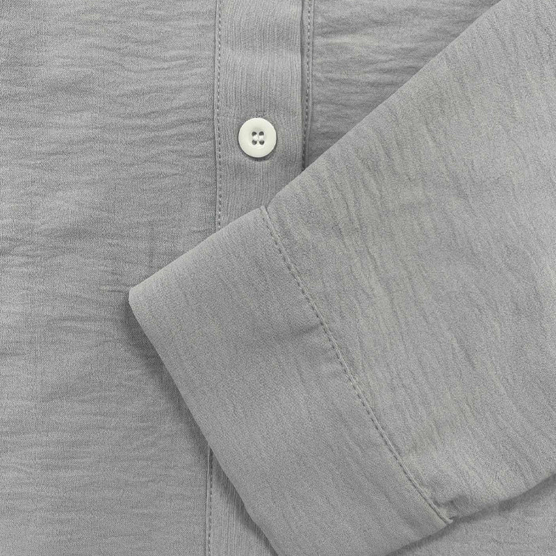 Comfortable men's button-front long sleeve shirt, perfect for casual summer outfits and warm days.