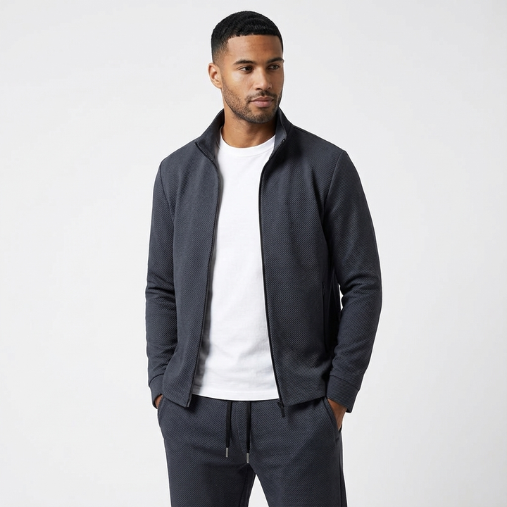 Sporty men's two-piece tracksuit featuring a full-zip jacket and comfortable jogger pants, ideal for casual wear.