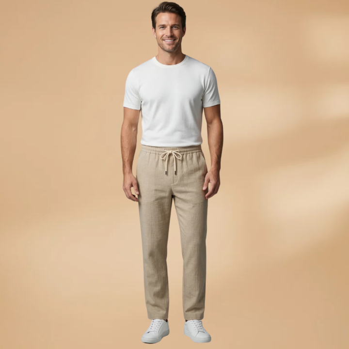 Relaxed fit men's casual trousers featuring comfortable drawstring waist, ideal for all-season wear.