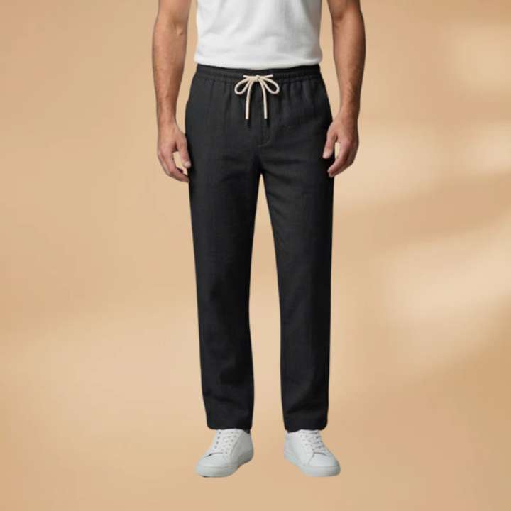 Close-up of adjustable drawstring waistband on men's relaxed fit casual trousers, showcasing comfort.