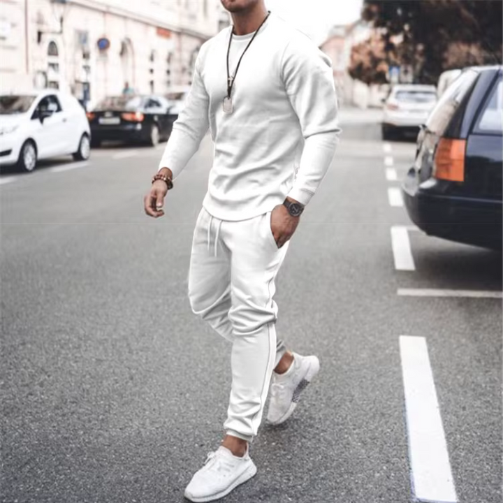 Man relaxing in a comfortable, loose-fit casual two-piece cotton lounge set with handy pockets.