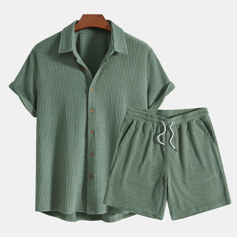 Relaxed fit men's button-up shirt and matching shorts, perfect for warm weather and beachwear.