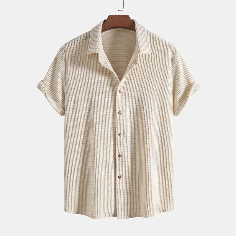 Men's summer vacation wear: a comfortable two-piece casual shirt & shorts outfit. Beach-ready.
