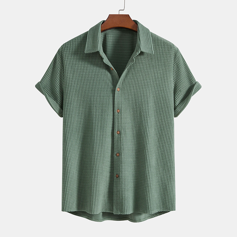 Comfortable men's two-piece lounge set with short-sleeve shirt & shorts for warm weather casual wear.