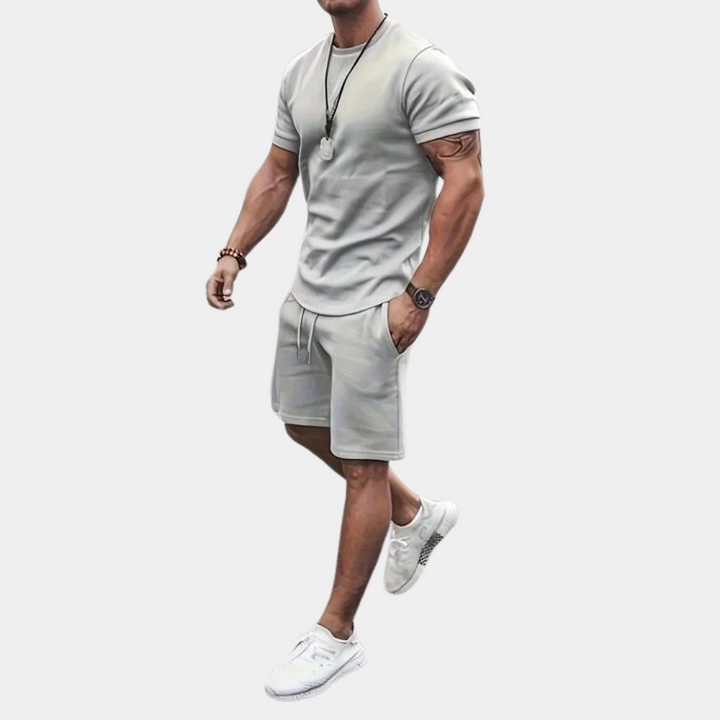 Stylish men's summer two-piece outfit with breathable casual shirt and shorts, ideal for beachwear & loungewear.
