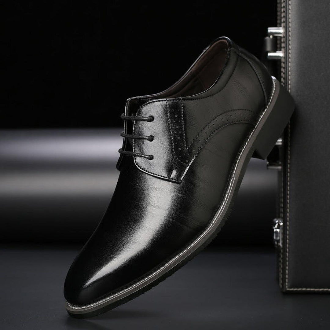Men's timeless formal lace-up shoes in polished leather, enhancing wedding and business attire.