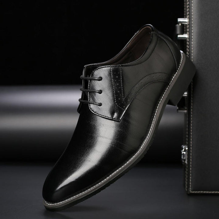 Men's timeless formal lace-up shoes in polished leather, enhancing wedding and business attire.