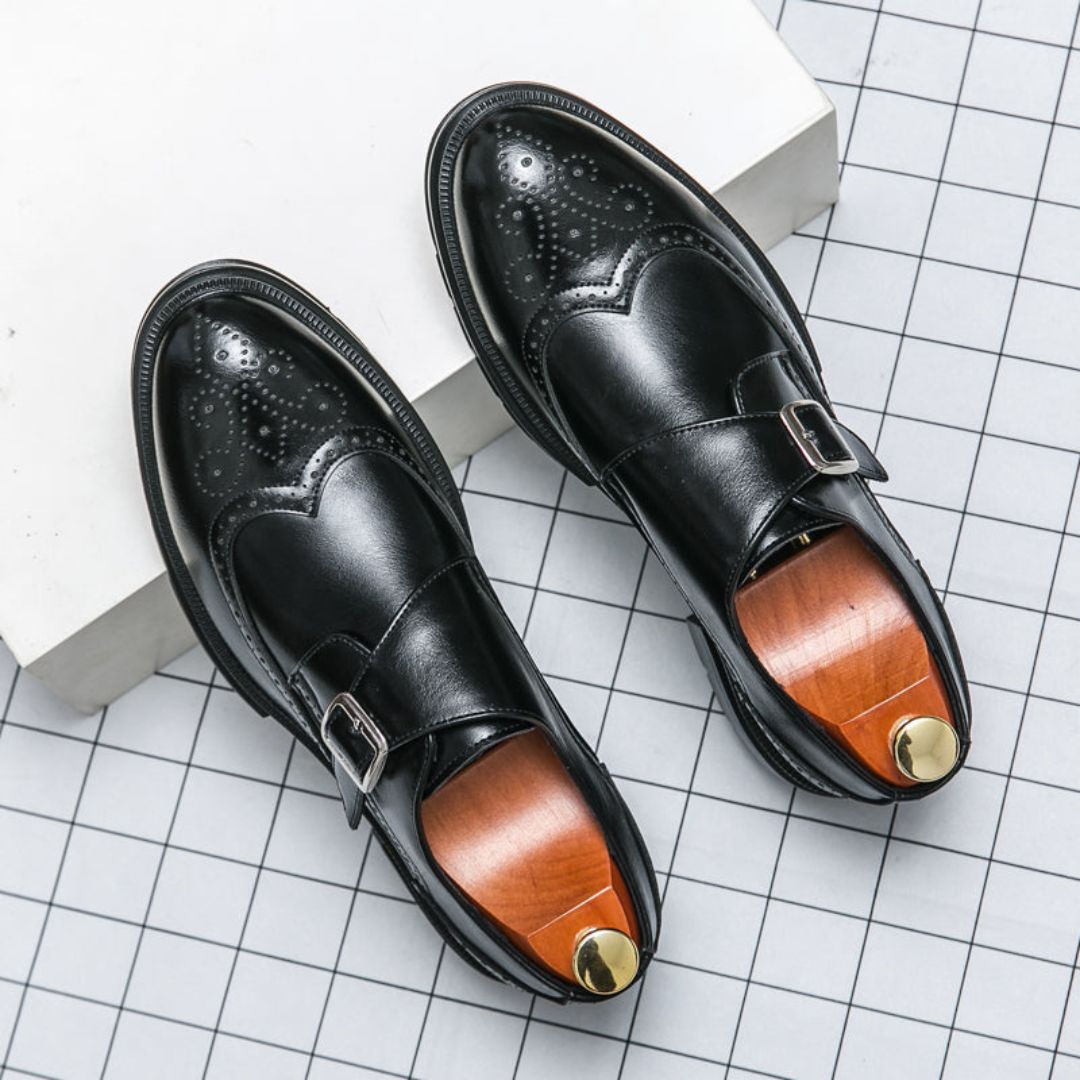 Men's classic black leather monk strap wingtip dress shoes with brogue details for business attire.