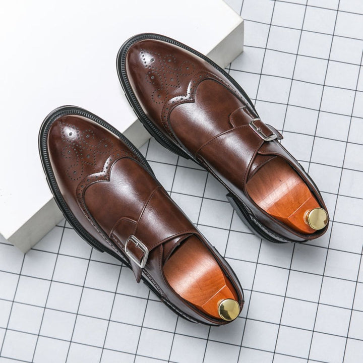 Men's formal leather monk strap wingtip shoes with sleek design, enhancing a sophisticated business look.