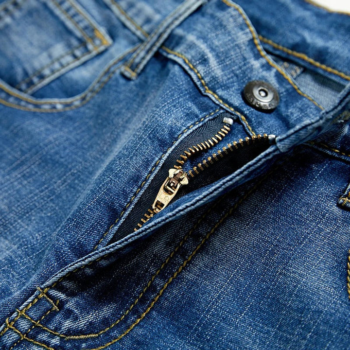 Modern classic men's straight leg denim shorts. Comfortable five-pocket design for versatile summer outfits.