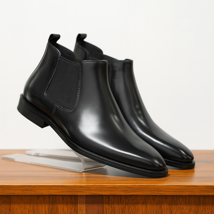 Stylish men's black Chelsea boots; comfortable & versatile ankle footwear for daily wear. Classic design, slip-on.
