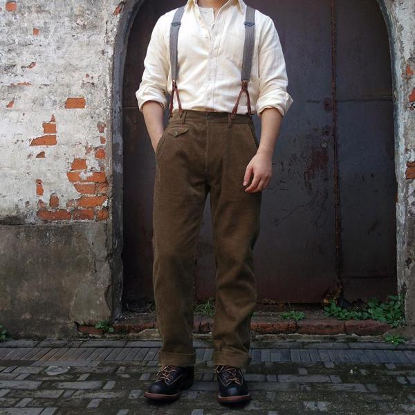 Men's classic brown pleated trousers with adjustable suspenders, perfect for formal or smart casual wear.