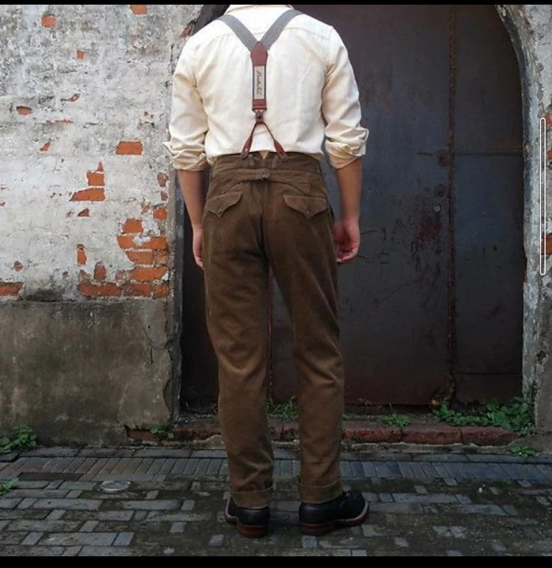 Stylish men's office wear: brown pleated trousers with suspenders. Ideal for business & formal events.