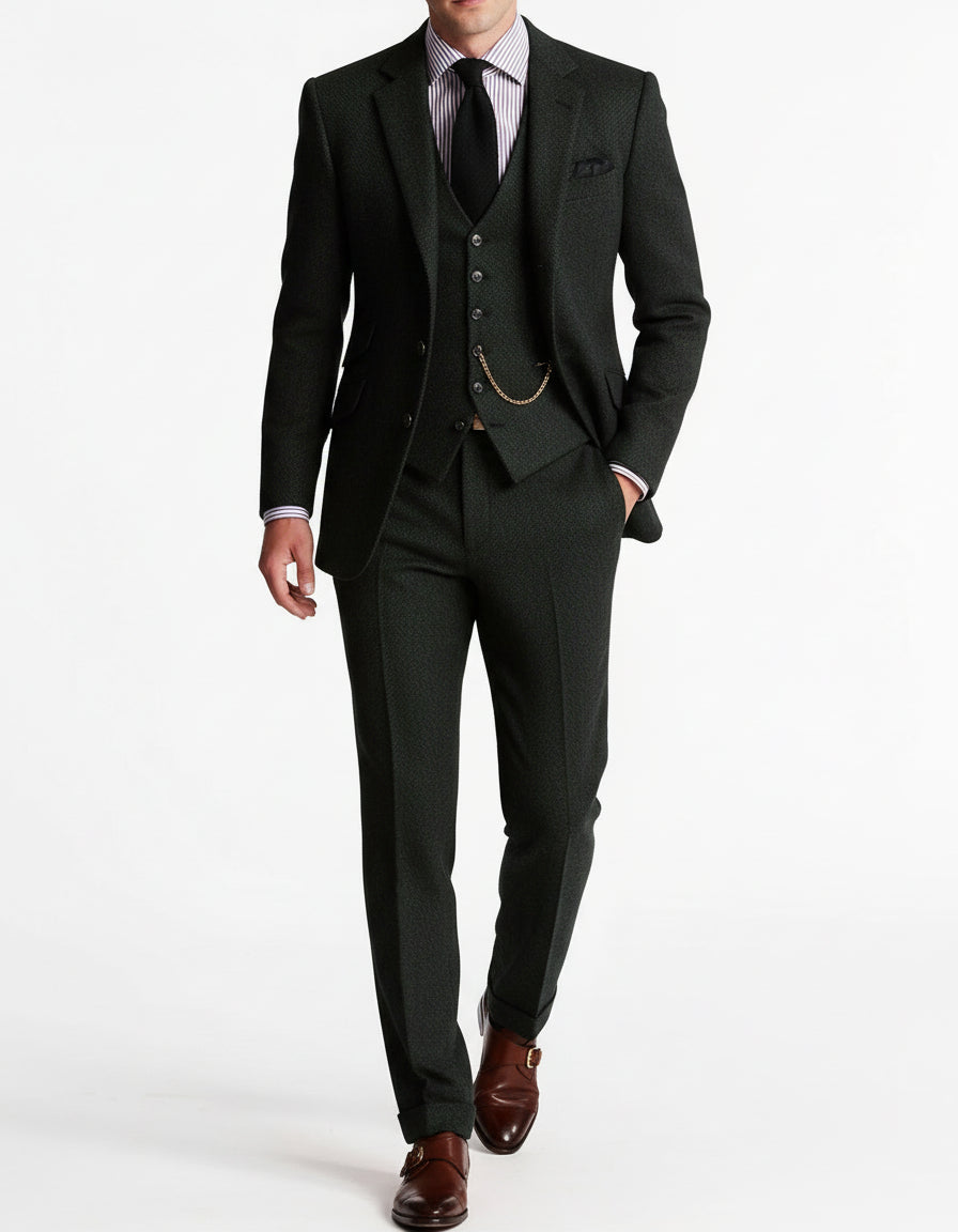 Tailored men's tweed suit in a classic fit, ideal for a refined gentleman's party or event.