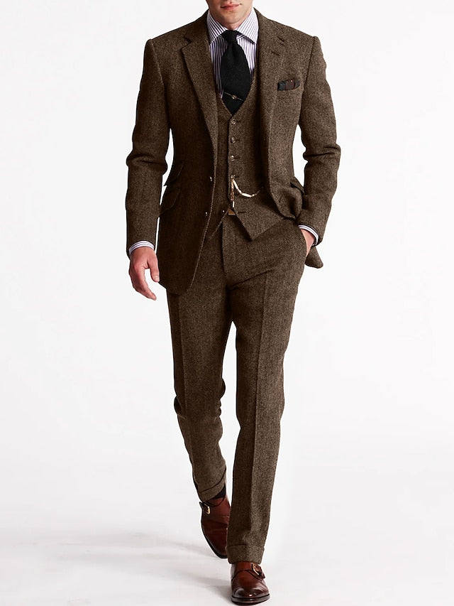 Elegant three-piece tweed suit for men, featuring a stylish jacket, vest, and trousers, winter fashion.