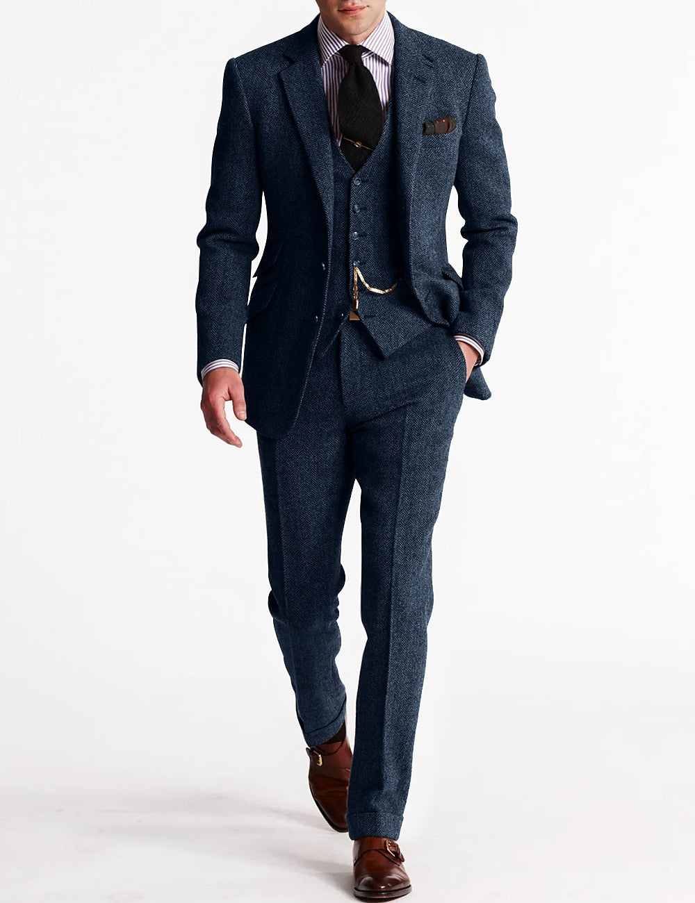 Full-length view of a gentleman modeling a timeless men's tweed three-piece suit, wedding appropriate.
