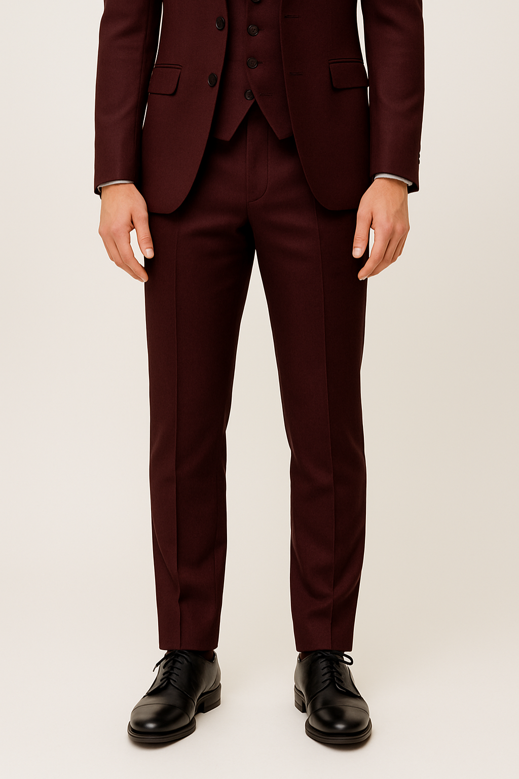 Close-up of a burgundy men's formal suit fabric, showcasing its quality and tailored design