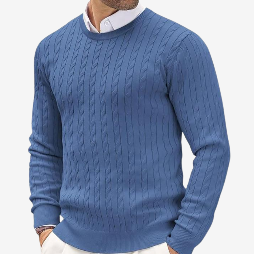 Close-up of a warm men's classic cable knit crew neck sweater. Ideal for autumn and winter style.