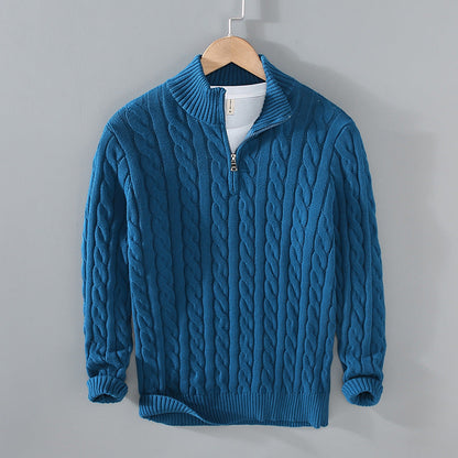 Fashionable men's quarter-zip sweater with cable knit design, ideal for a warm winter outfit.