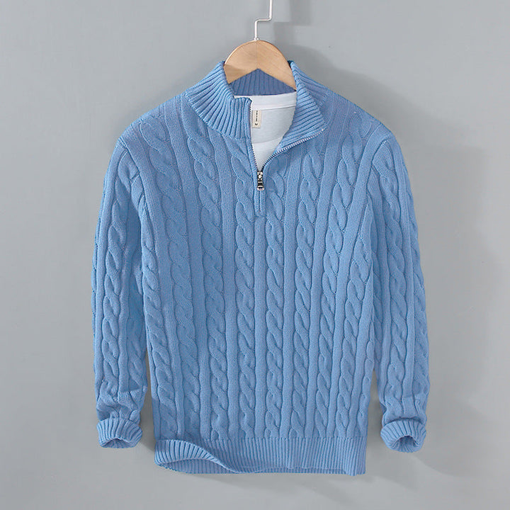 A men's cable knit pullover with a quarter-zip, offering classic style and comfortable warmth.