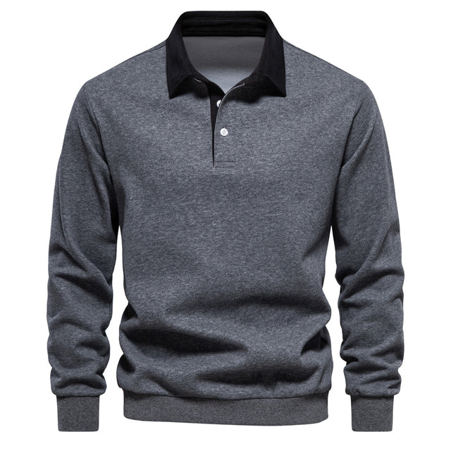 Close-up of the classic collar and knit texture of a men's long sleeve polo shirt
