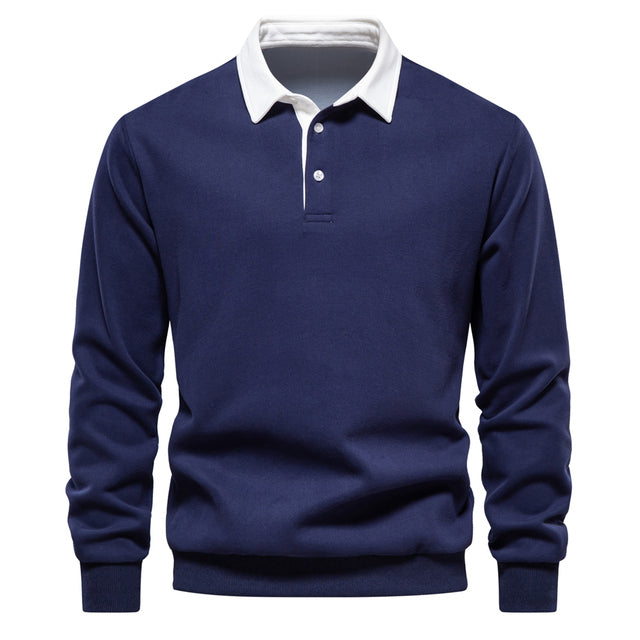 Detailed view of the button placket on a men's long sleeve classic collar polo shirt