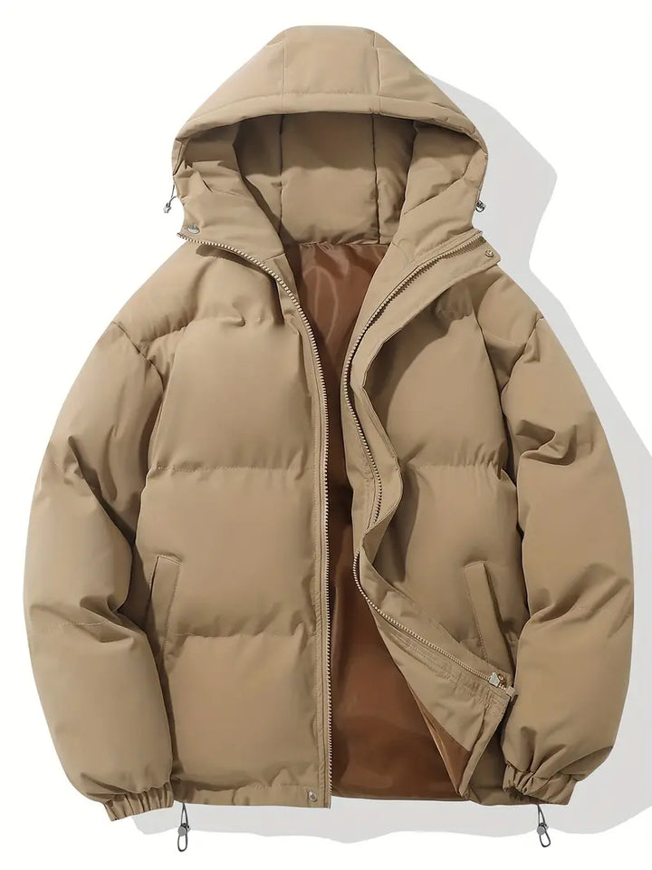 Side profile of a man wearing a warm hooded jacket, ideal for winter outdoor activities.