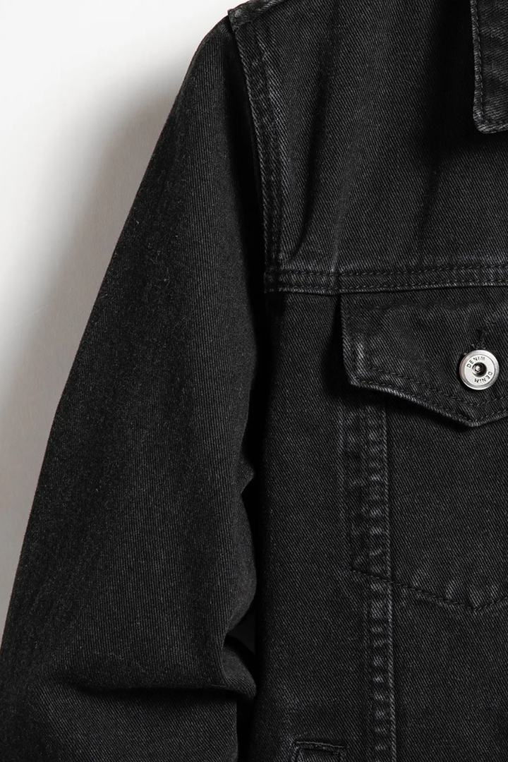 Timeless men's classic fit black denim jacket. Button-up design, versatile casual outerwear for any occasion.