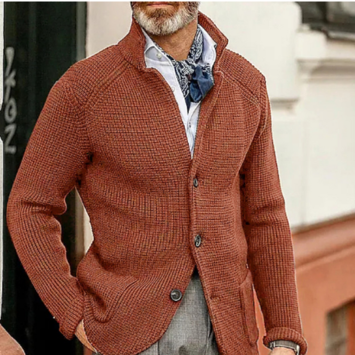Man in a warm brown button-up cardigan, enjoying comfortable indoor casual wear and style.